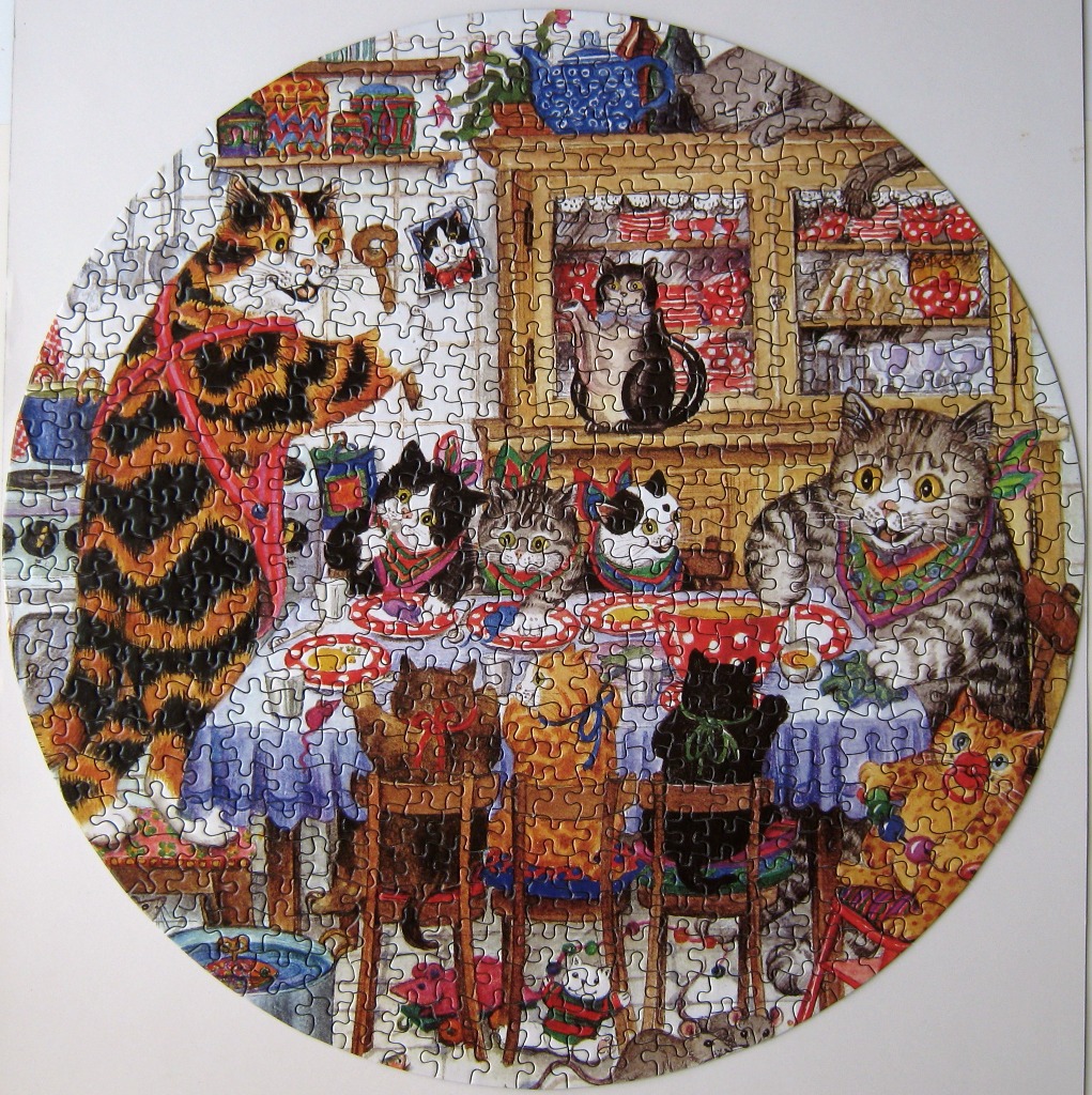 Whimsical illustration of several cats enjoying a tea party in a country kitchen