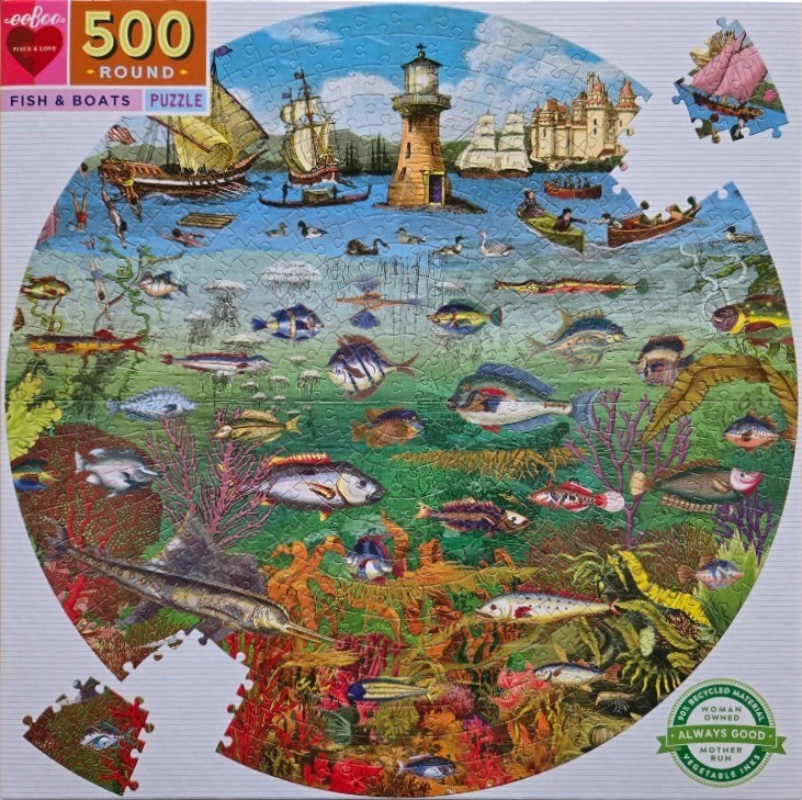 A round illustration of a coastal scene featuring ships above the water line and a vibrant coral reef below.
