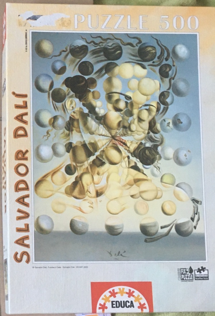 The Galatea of the Spheres by Salvador Dalí, featuring a face composed of floating spheres.