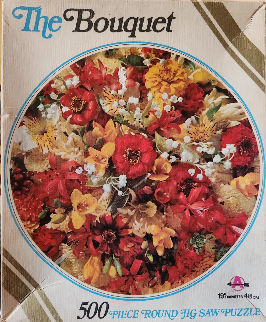 A close-up photograph of a dense, vibrant bouquet of red, yellow, and white flowers arranged in a circular frame.
