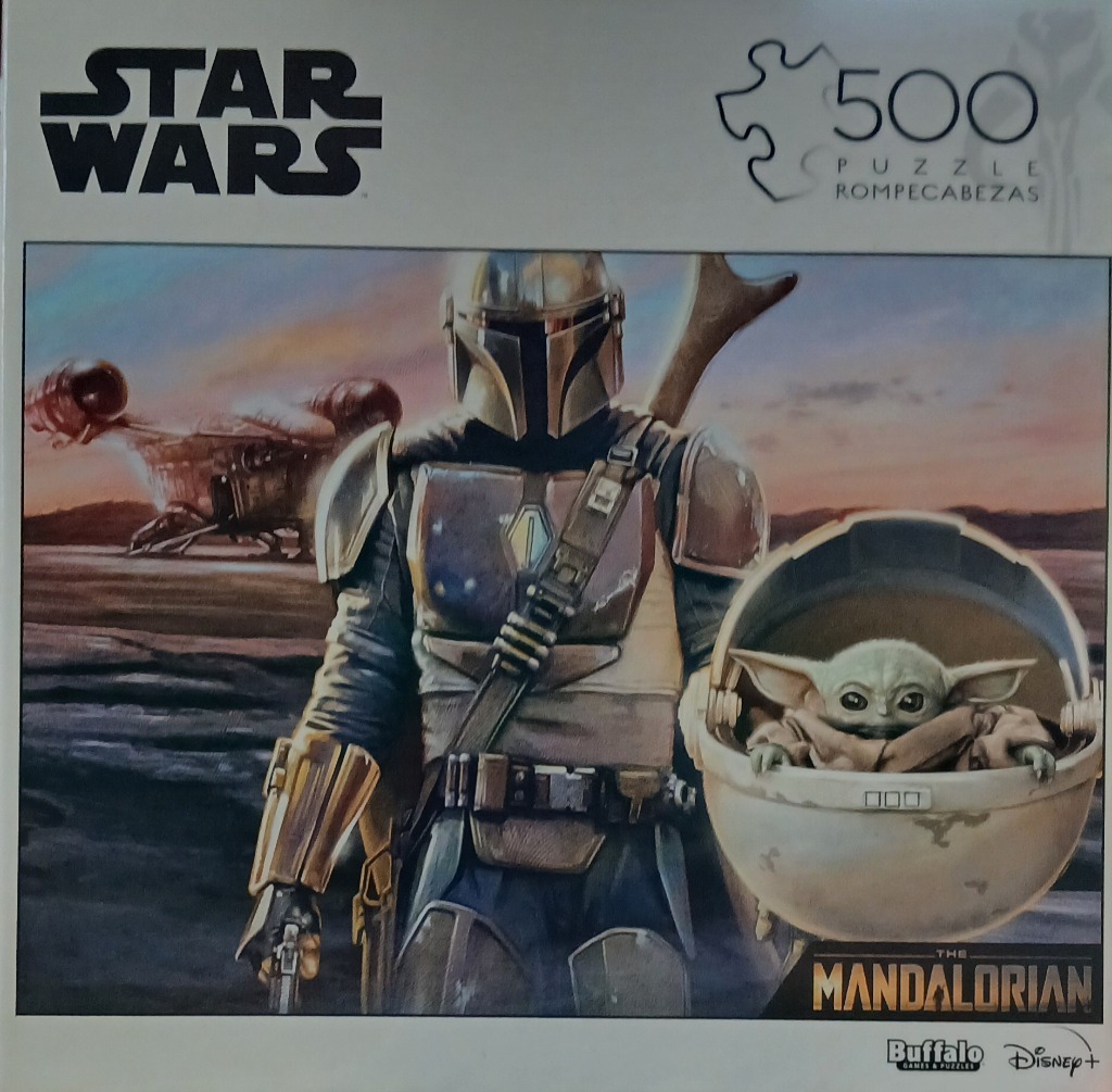The Mandalorian and Grogu standing on a desert planet with their ship in the background