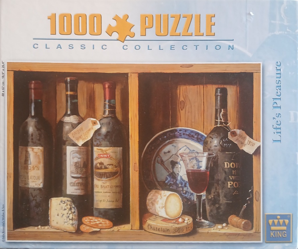Still life painting of wine bottles, cheese, and a decorated plate in wooden cubby shelves.