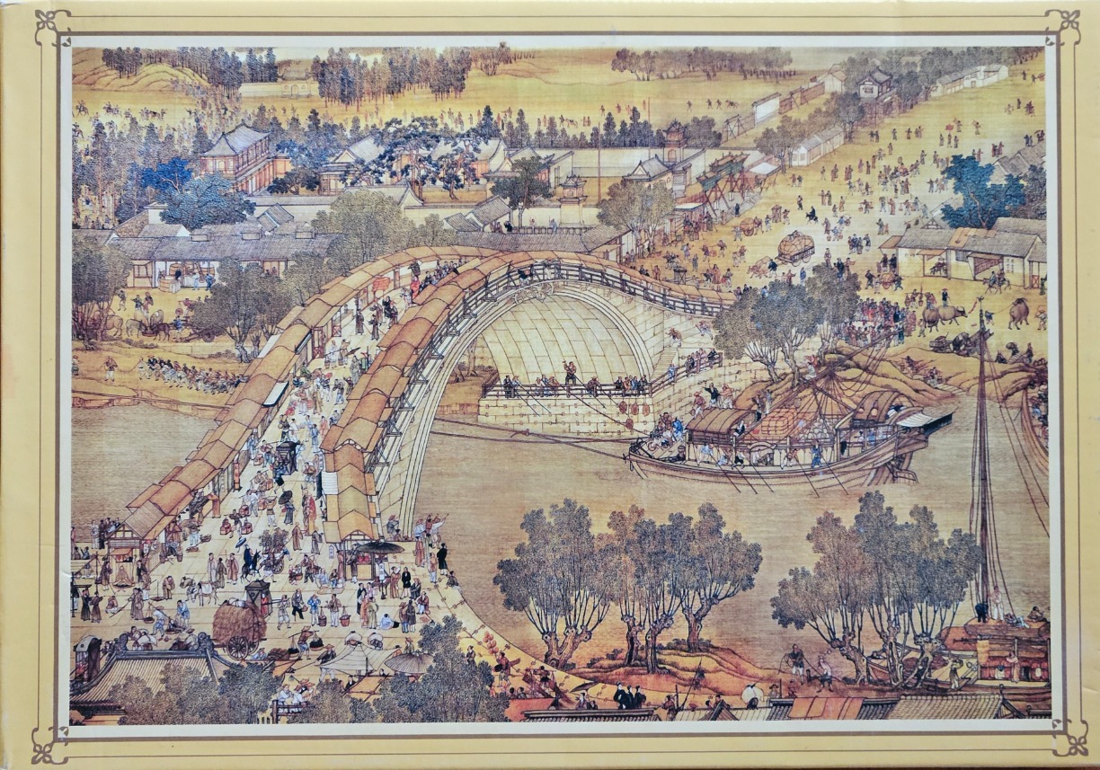 A traditional Chinese painting depicting a bustling riverside scene with a large arched bridge and many figures.