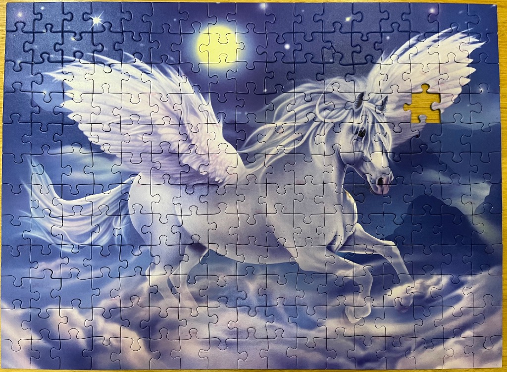 A majestic white Pegasus flying through a starry night sky with a full moon.
