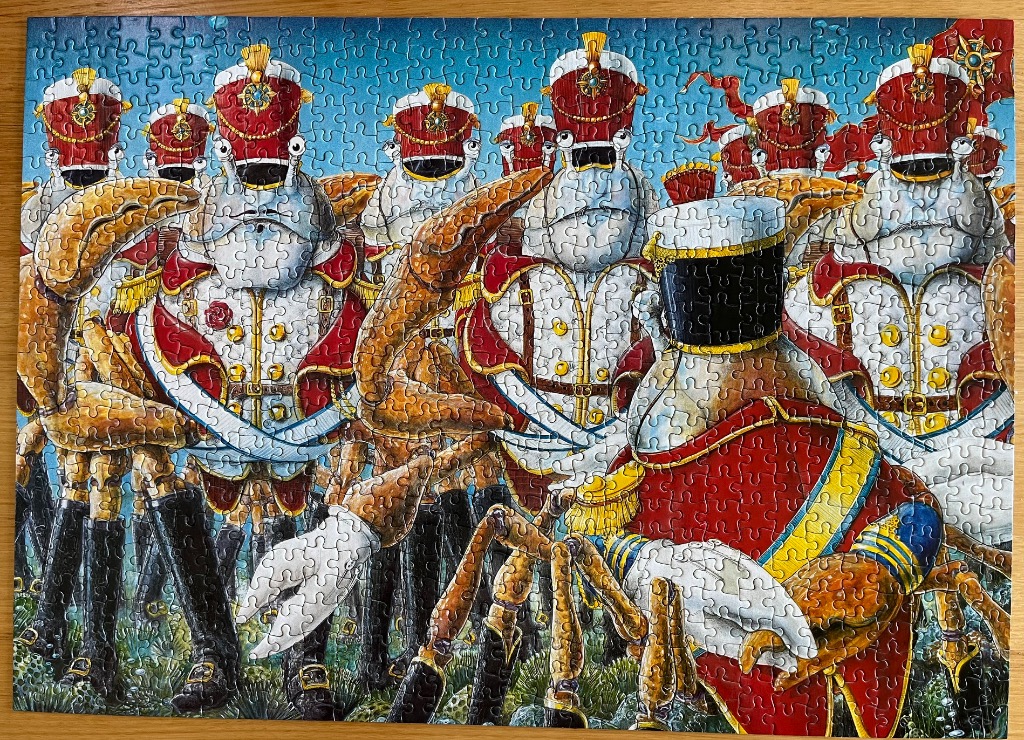 An army of anthropomorphic crab soldiers in red military uniforms standing in a field.