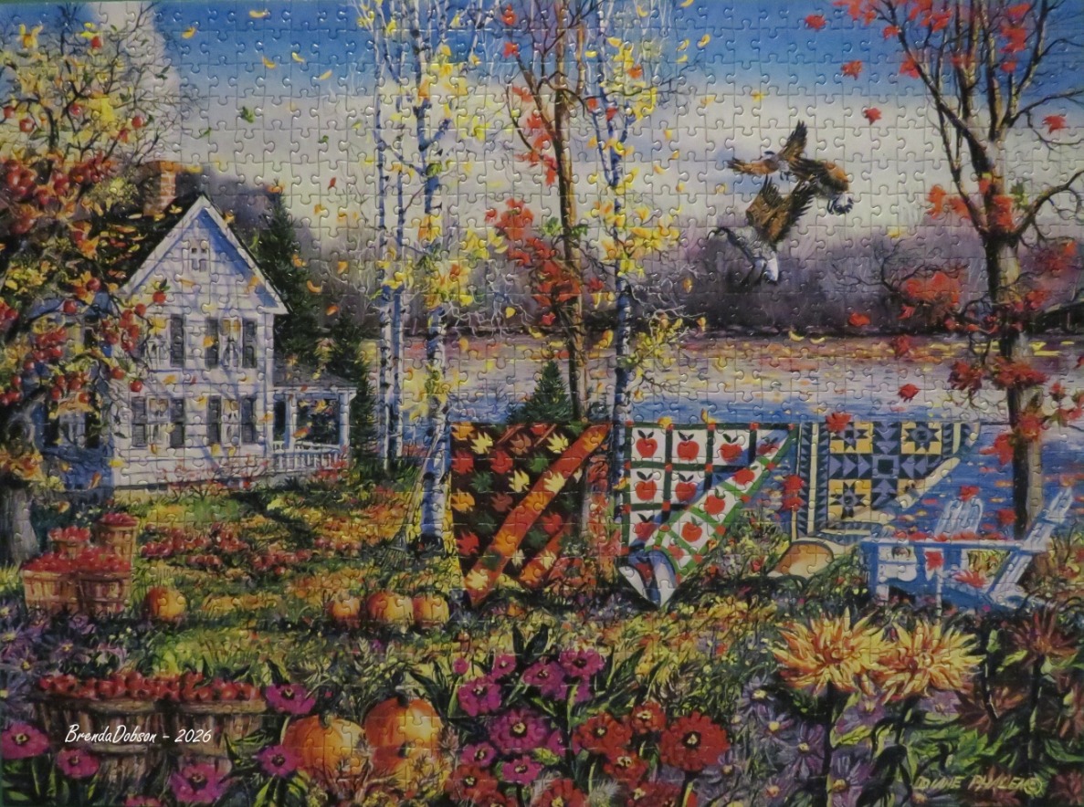 A peaceful autumn scene featuring a white farmhouse, quilts hanging on a clothesline, and soaring eagles.