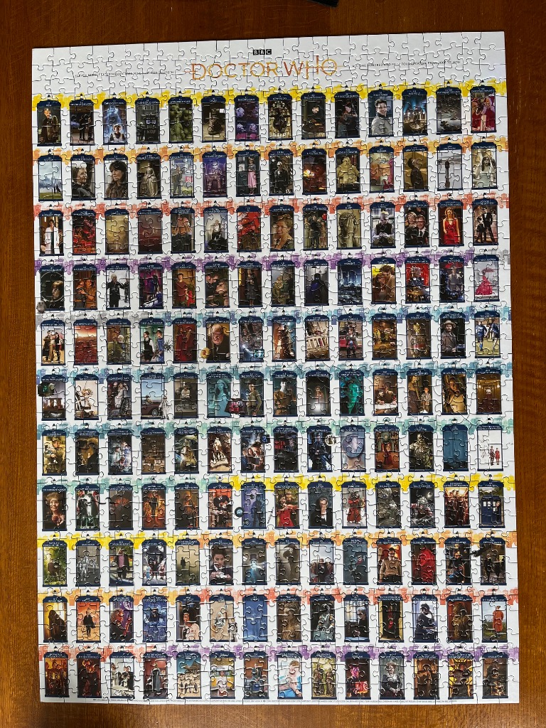 A grid of 100 Doctor Who episode images arranged in a gallery style poster.