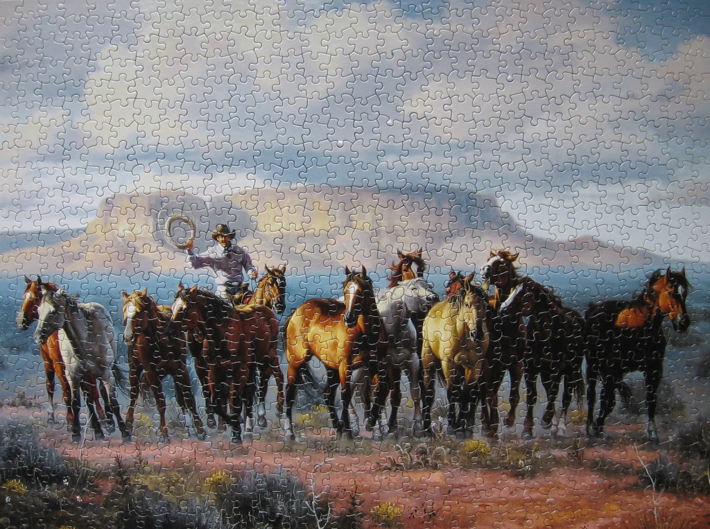 Western oil painting of a cowboy herding a group of horses across a desert landscape beneath a cloudy sky.