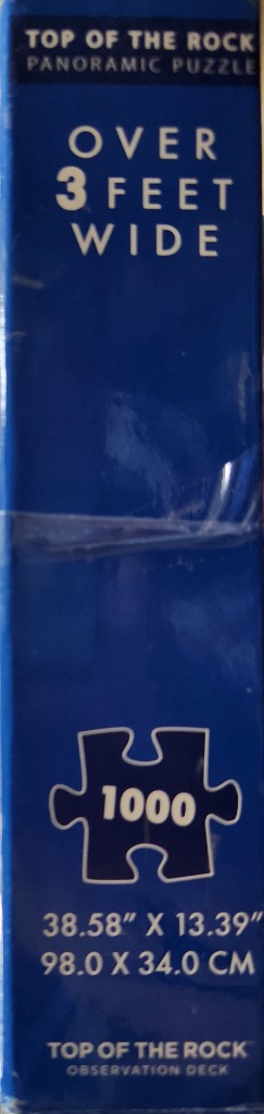 Blue box with "Top of the Rock" text and a puzzle piece with "1000".