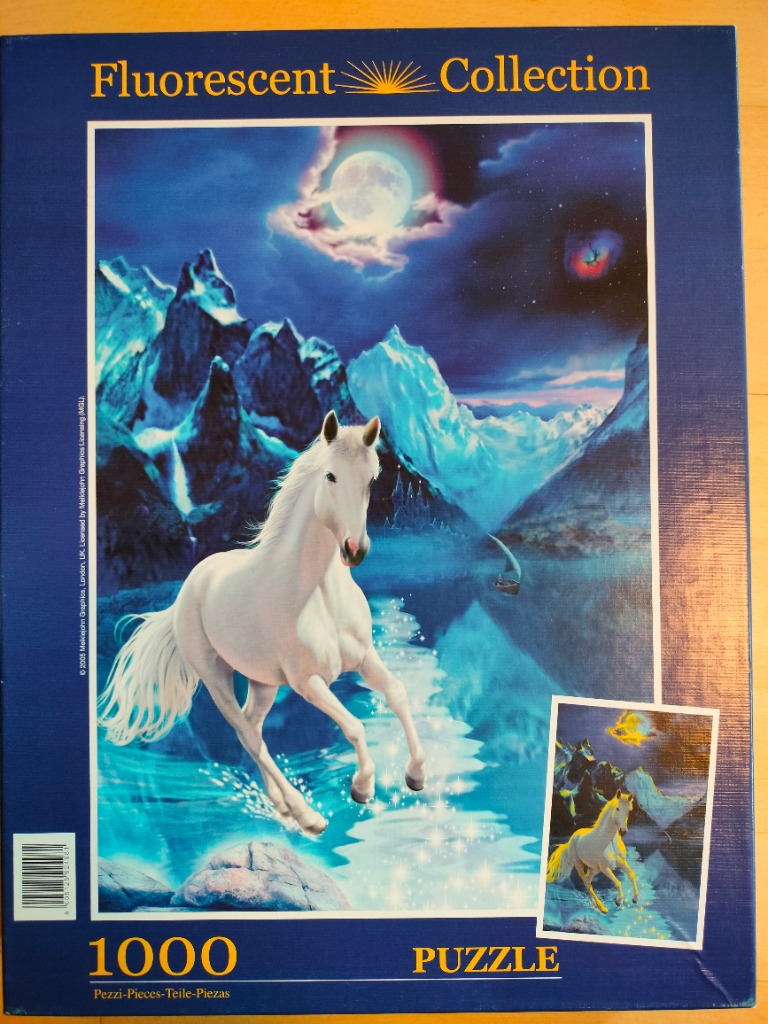 A white horse galloping across a glowing blue stream in front of snow-capped mountains under a full moon.