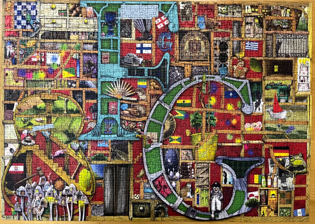 A whimsical collage of a giant letter G filled with tiny shelves, flags, animals, and objects.
