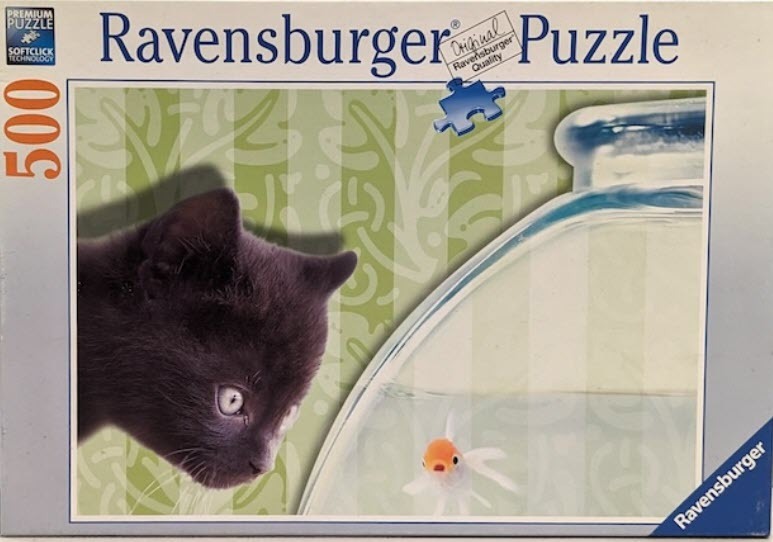 A close-up of a curious black kitten looking into a goldfish bowl against a soft green patterned background.