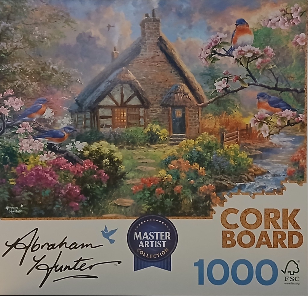 A peaceful cottage scene with bluebirds perched on blooming branches beside a small stream.