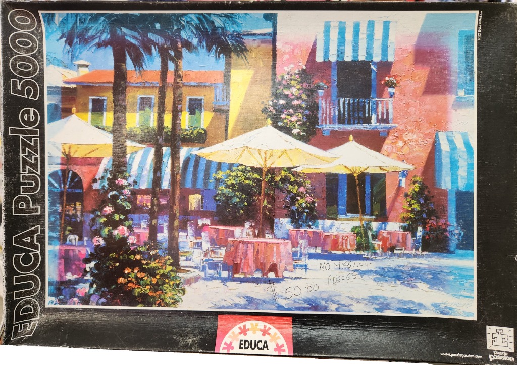 Impressionistic painting of a sunny Mediterranean outdoor cafe terrace with tables, umbrellas, and colorful buildings.