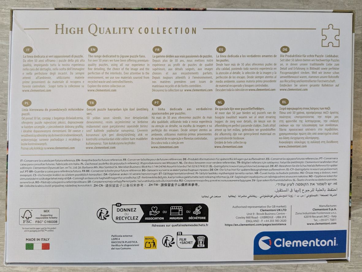 Box showing multilingual text, a puzzle piece graphic, and a puzzle manufacturer logo.