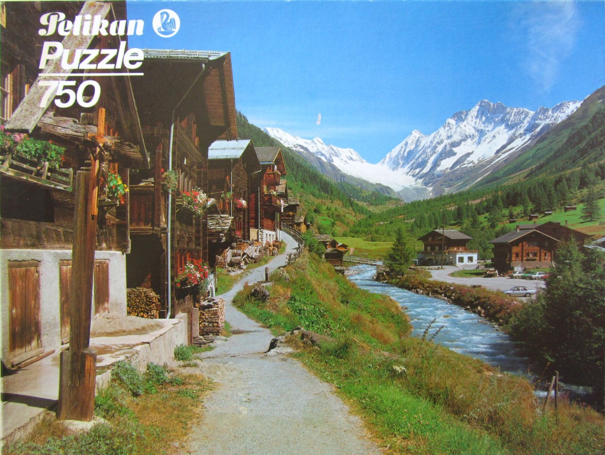 A sunny mountain landscape featuring traditional wooden chalets lining a path beside a rushing river in the Swiss Alps.