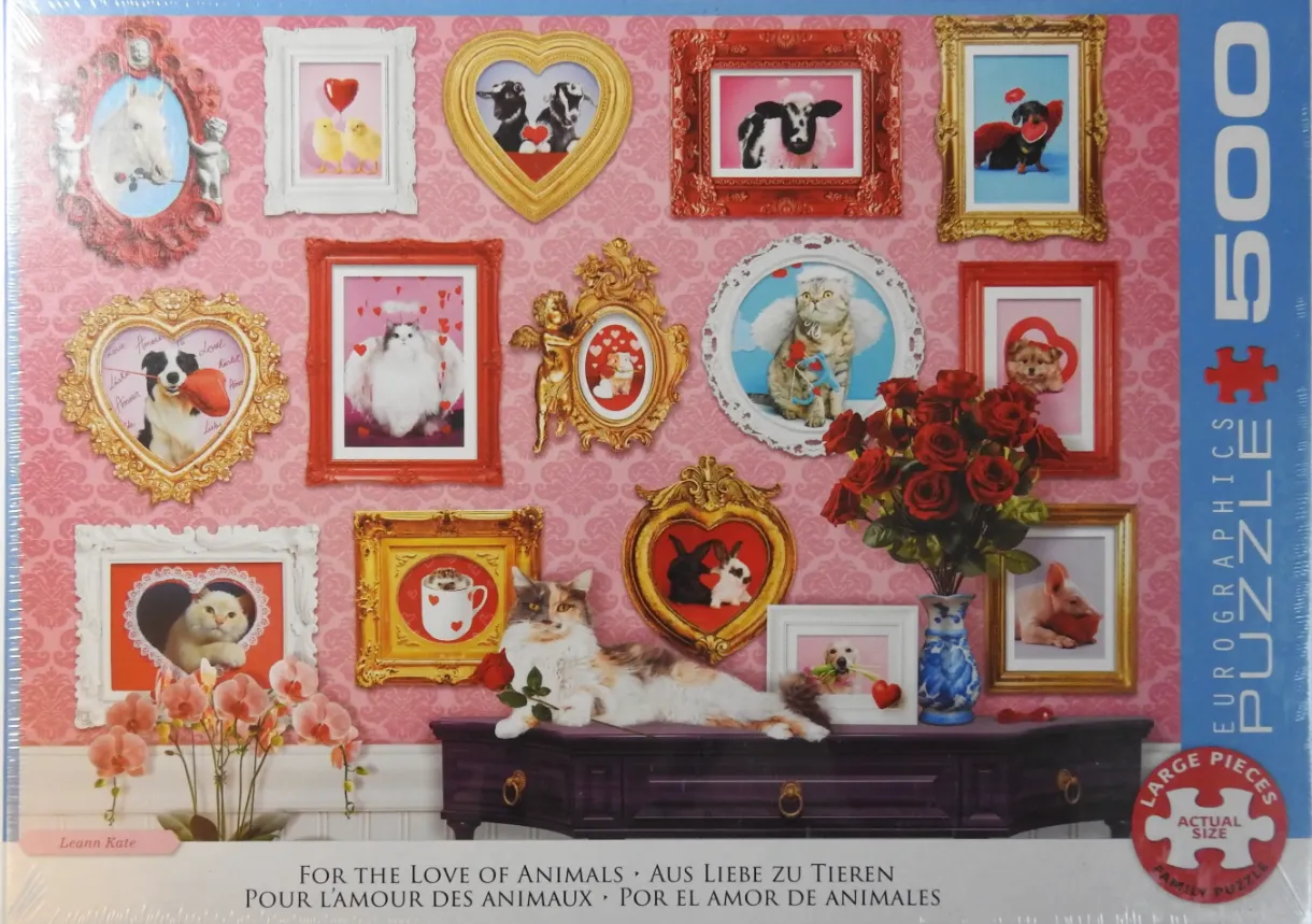 A gallery wall of framed animal portraits with a calico cat resting on a console table.