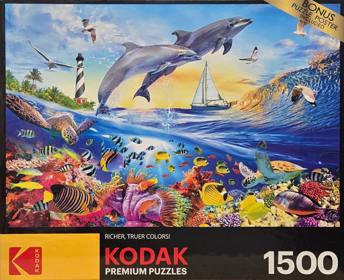 Dolphins leaping over a tropical ocean scene with a coral reef, sailboat, and lighthouse at sunset.