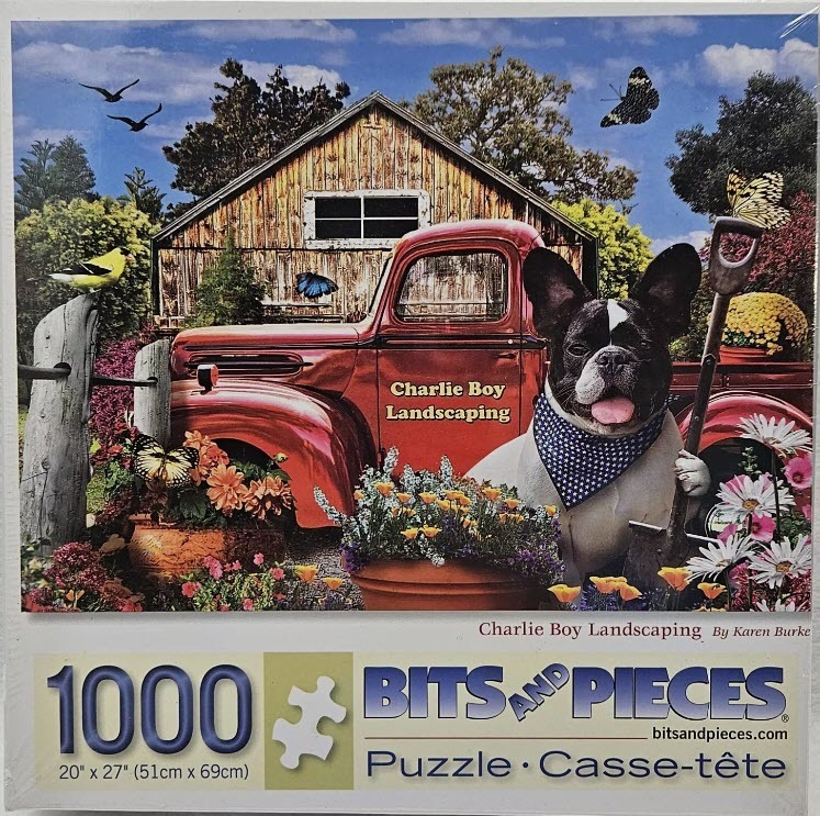 A French Bulldog wearing a blue bandana sits in front of a red vintage truck in a garden.