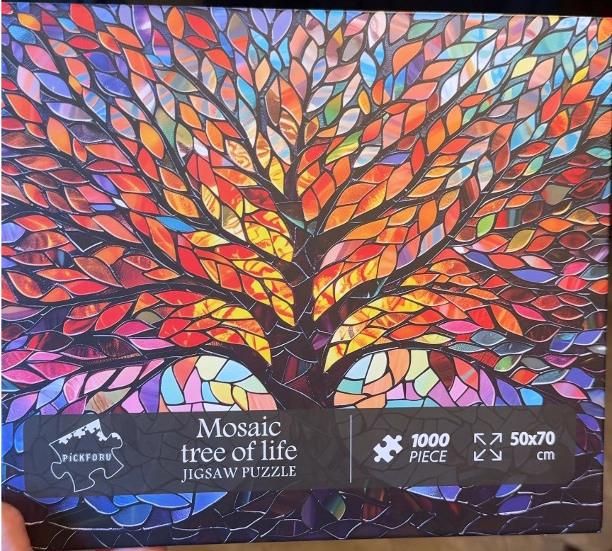 A mosaic-style artwork of a Tree of Life with vibrant, multi-colored leaves against a dark background.