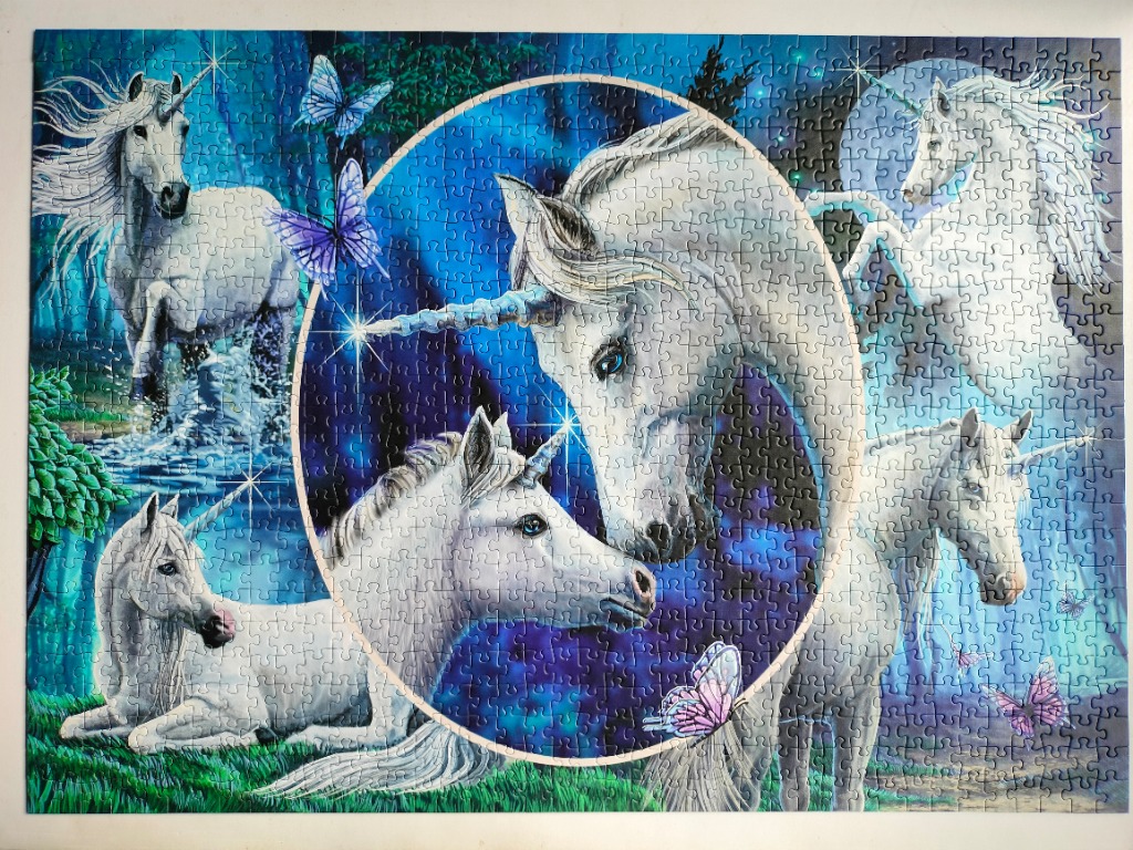 A fantasy illustration of multiple white unicorns in a magical, blue-toned forest setting.
