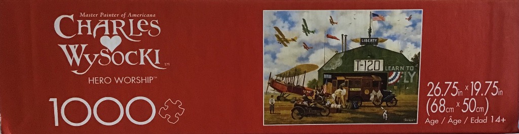 Vintage Americana painting of early 20th-century biplanes, a hangar, and people at an airfield.