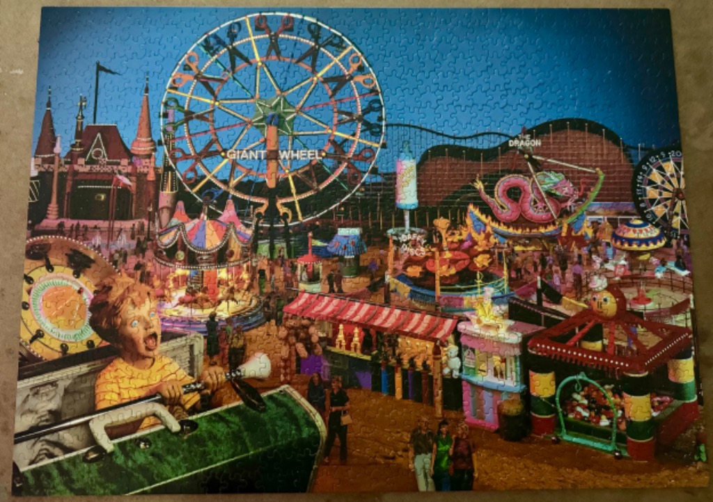 A night scene at a whimsical amusement park with a Ferris wheel made of scissors and a child in a ride carriage.