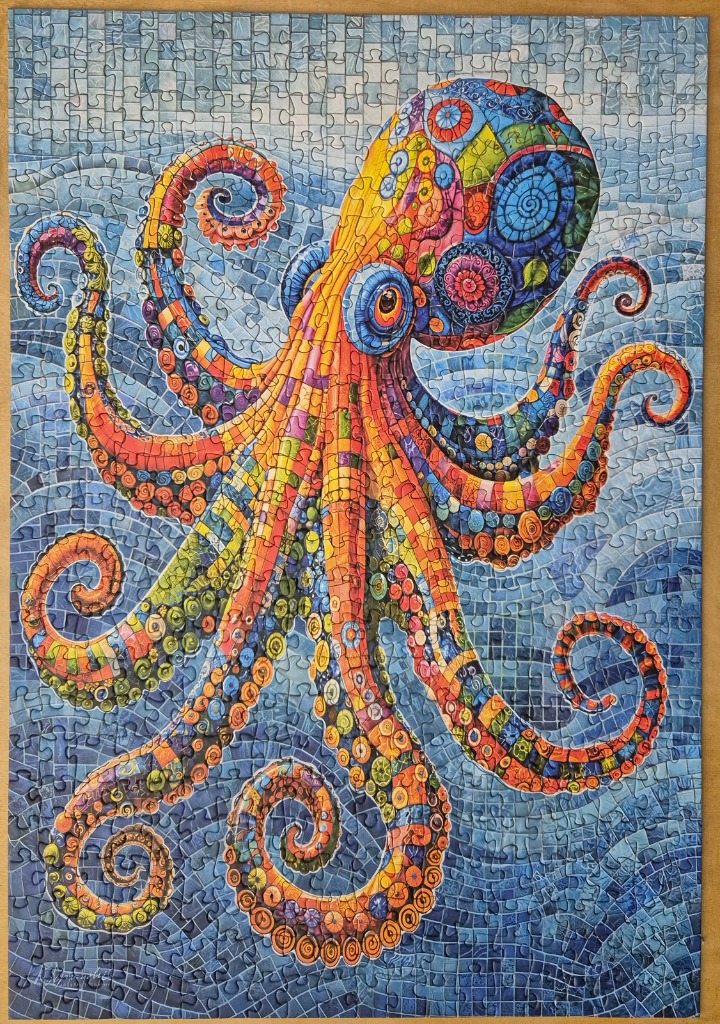 A vibrantly patterned, colorful mosaic-style octopus swimming against a blue tiled background.