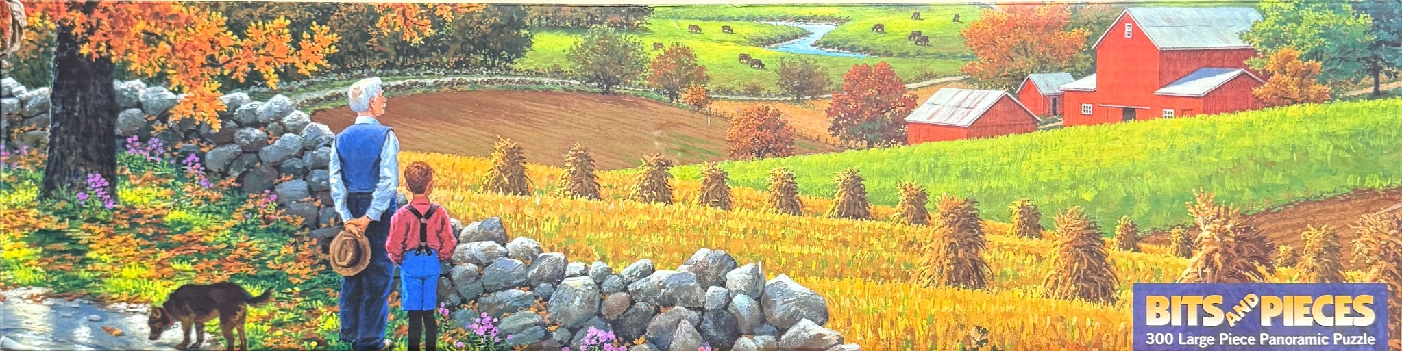 An elderly man and a young boy stand by a stone wall looking out over an autumn farm landscape with a red barn.