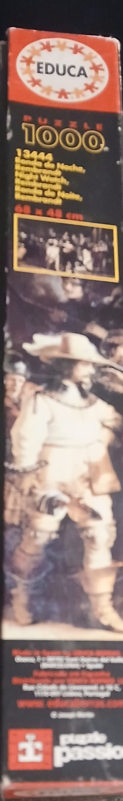 A reproduction of Rembrandt's The Night Watch featuring a group of militia men in 17th-century attire.