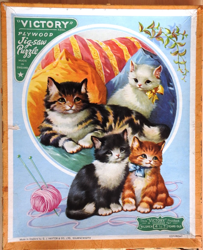 A vintage illustration of four kittens with a ball of yarn against a blue background.