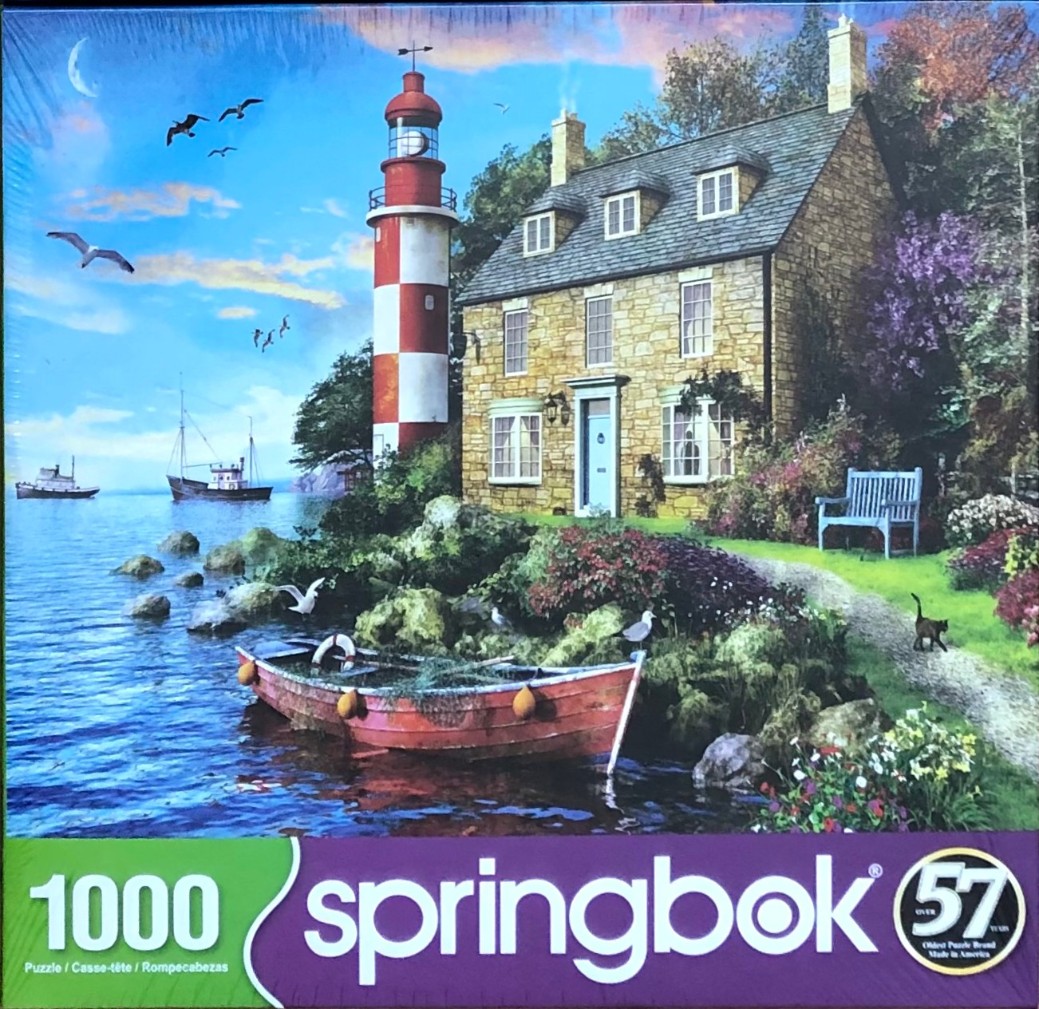 A lighthouse and stone cottage on a coastal cliff with a red rowboat in the water, under a twilight sky.