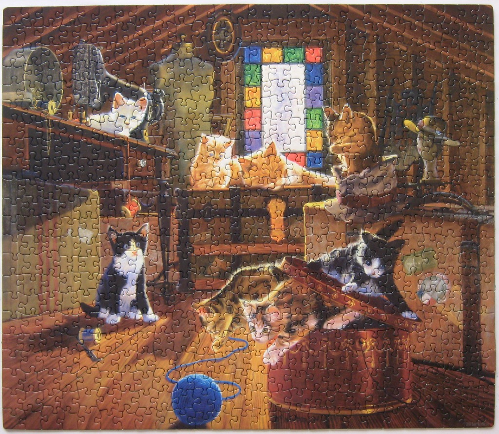 A cozy attic scene filled with several kittens and various vintage items including an old sewing machine.