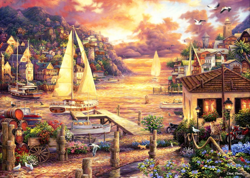 A Mediterranean-style seaside town at sunset with sailboats in a harbor and a cobblestone path in the foreground.