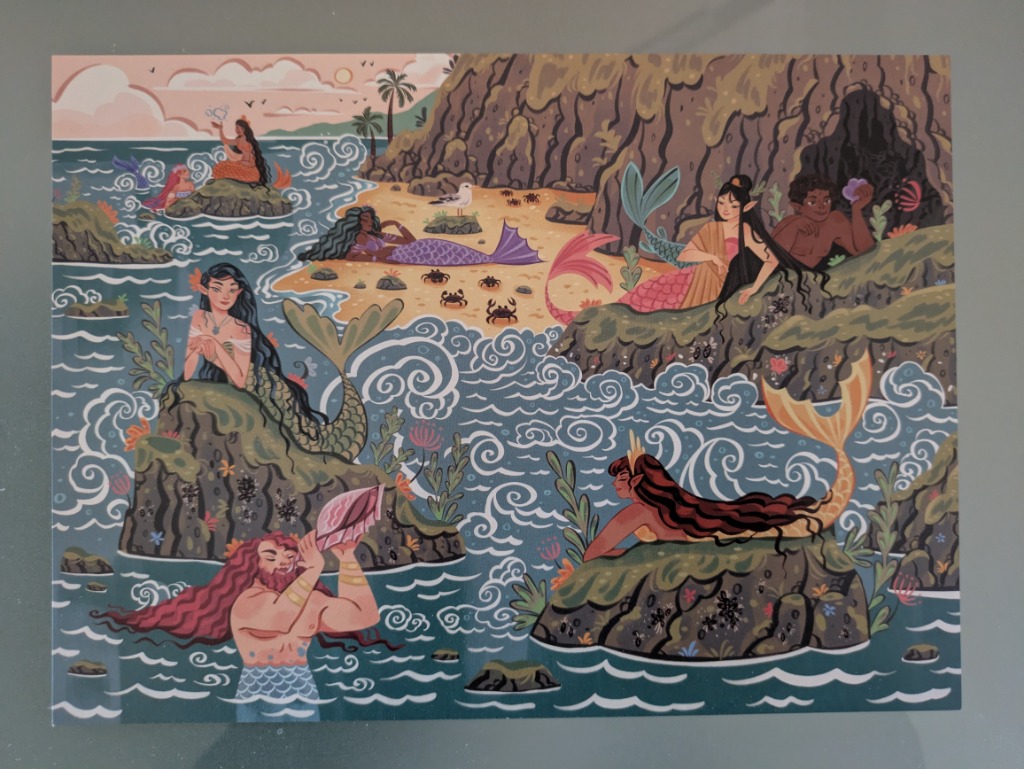 Illustration of several merfolk lounging on rocky sea outcroppings and a sandy beach in a whimsical coastal setting.