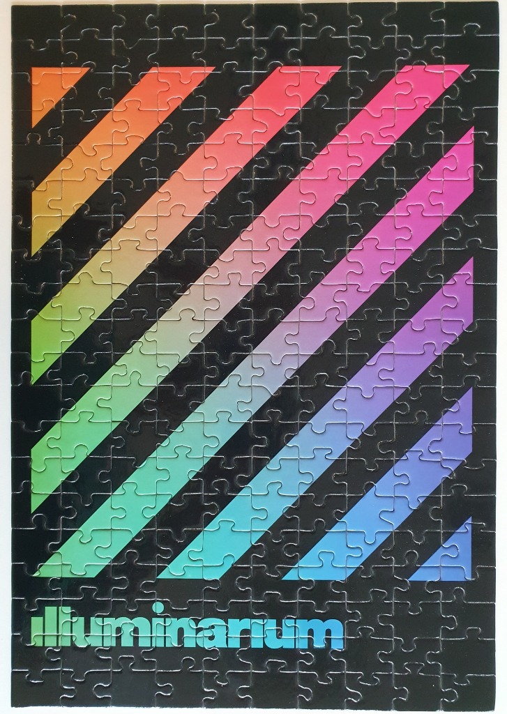 A minimalist design featuring diagonal rainbow stripes on a black background and the word Luminarium at the bottom.