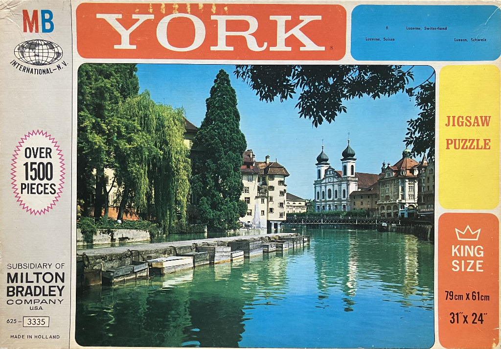 A vintage photograph of the Reuss River in Lucerne, Switzerland, featuring the Jesuit Church and surrounding architecture.