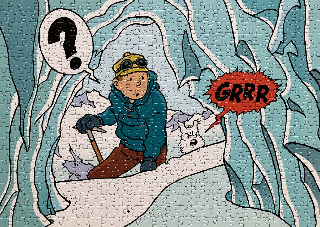A cartoon illustration of Tintin and Snowy in a snowy mountain cavern.