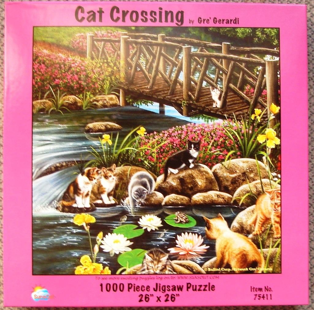 An illustration of several kittens playing by a stream under a rustic wooden footbridge surrounded by flowers.