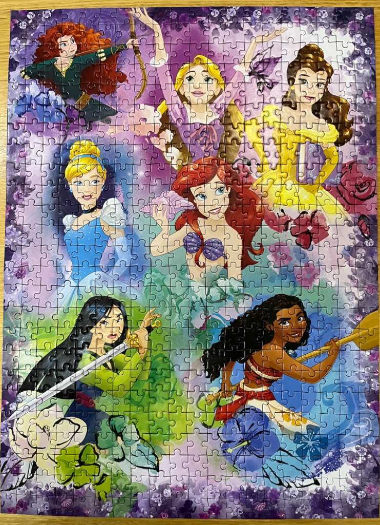 An illustration featuring seven animated princesses arranged in a collage against a floral purple background.