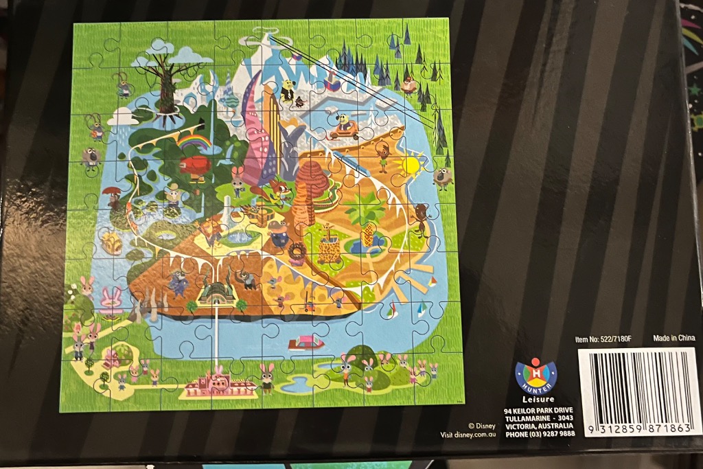 Illustrated map of a colorful city with various animals and diverse biomes