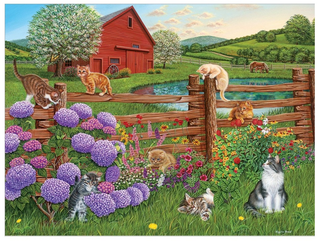 A group of cats and kittens playing in a lush garden with a red barn in the background.