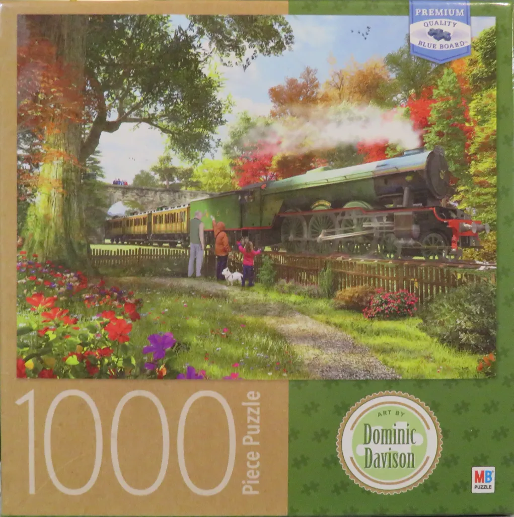 A steam train passing through a vibrant autumn garden with a family watching.