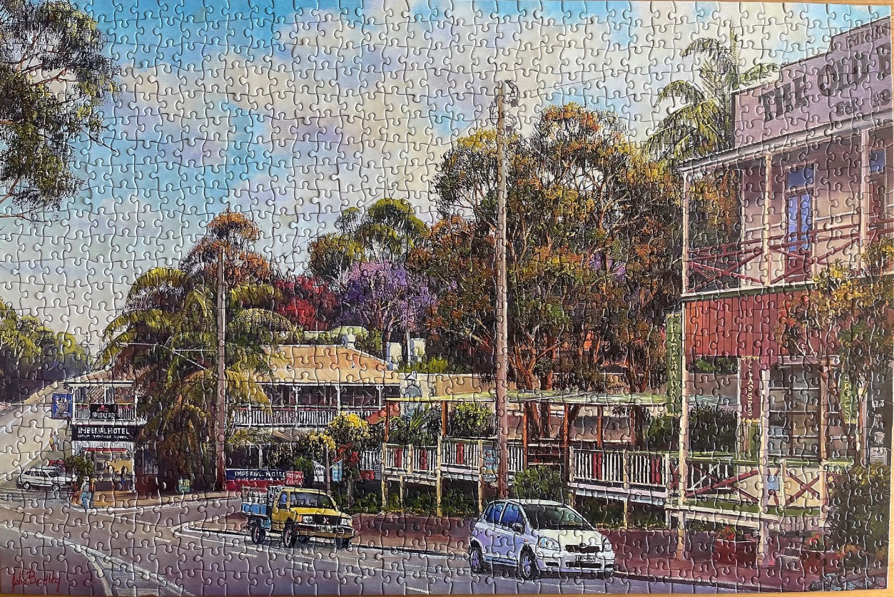 An oil painting of a sunny, quiet Australian street scene featuring the two-story Imperial Hotel and a white car.
