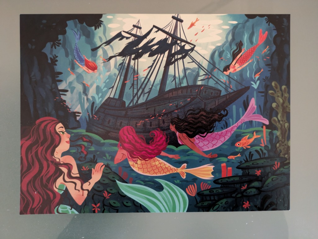 Illustration of several mermaids swimming around a dark, skeletal shipwreck on the ocean floor.