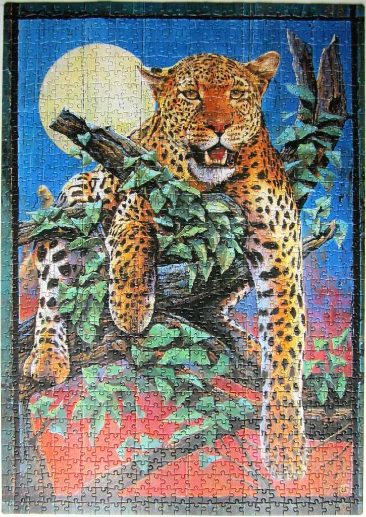 A leopard resting in a leafy tree against a large full moon at dusk