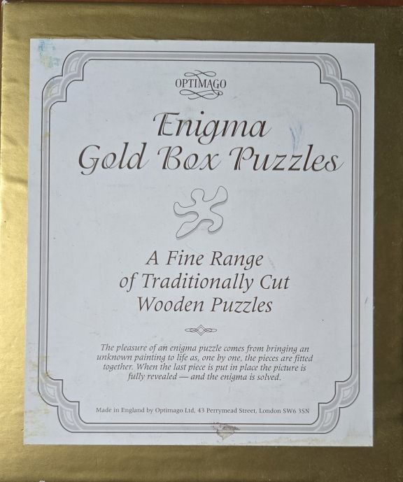 A rectangular gold-bordered graphic with elegant black text and an abstract shape centered on a white background.