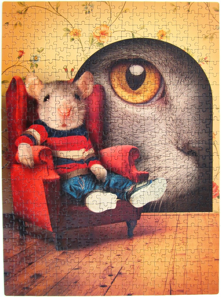A mouse in a striped shirt sits in a red chair while a giant cat eye watches from a dark archway.