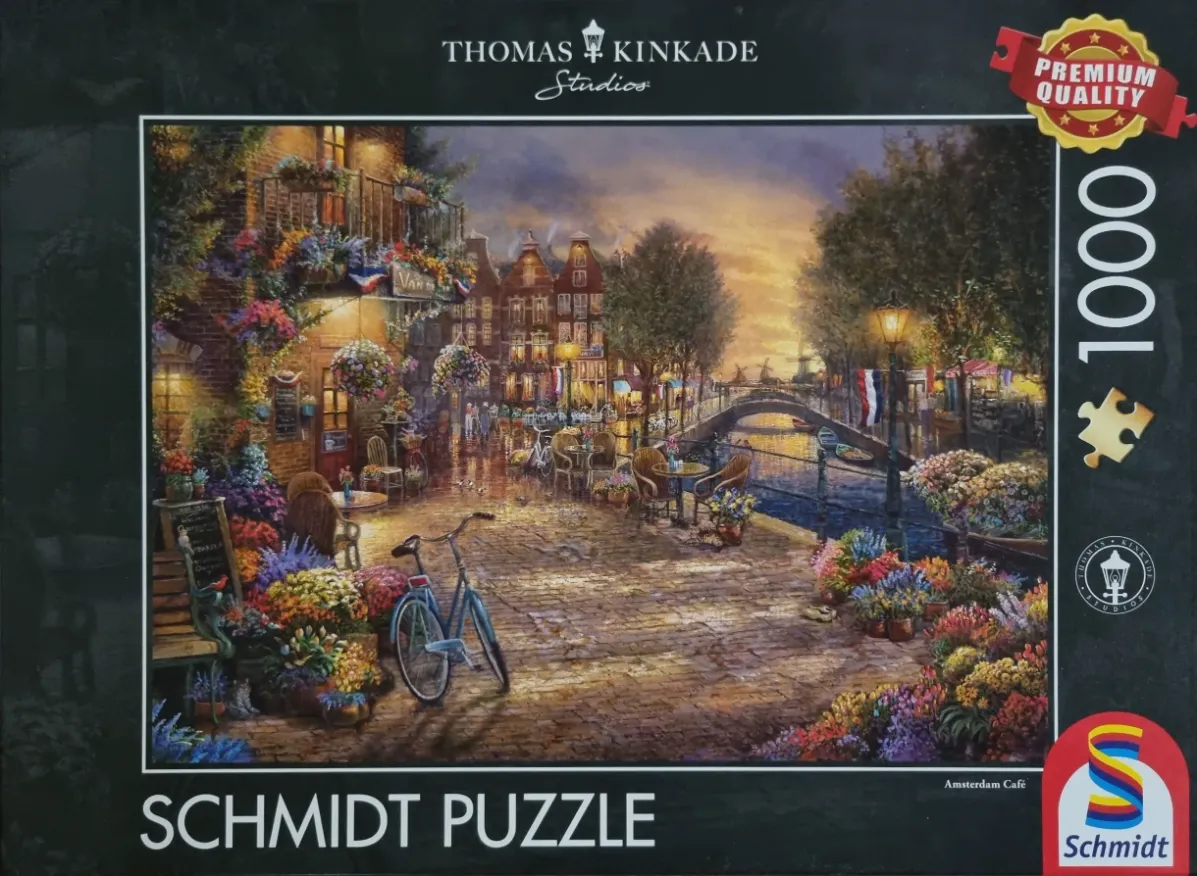 Painting of an Amsterdam canal scene at sunset with a cozy cafe, flower-filled street, and a parked bicycle.