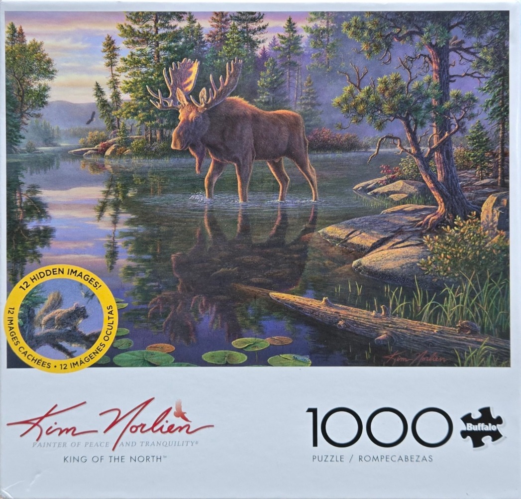 A majestic moose standing in a tranquil lake surrounded by a pine forest at sunset.